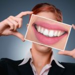 dental insurance Woman showing teeth